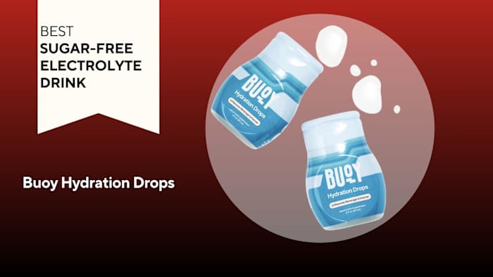 A red background with a banner reading "Best Sugar-Free Electrolyte Drink" next to two blue and white bottles of Buoy Hydration Drops electrolyte drink